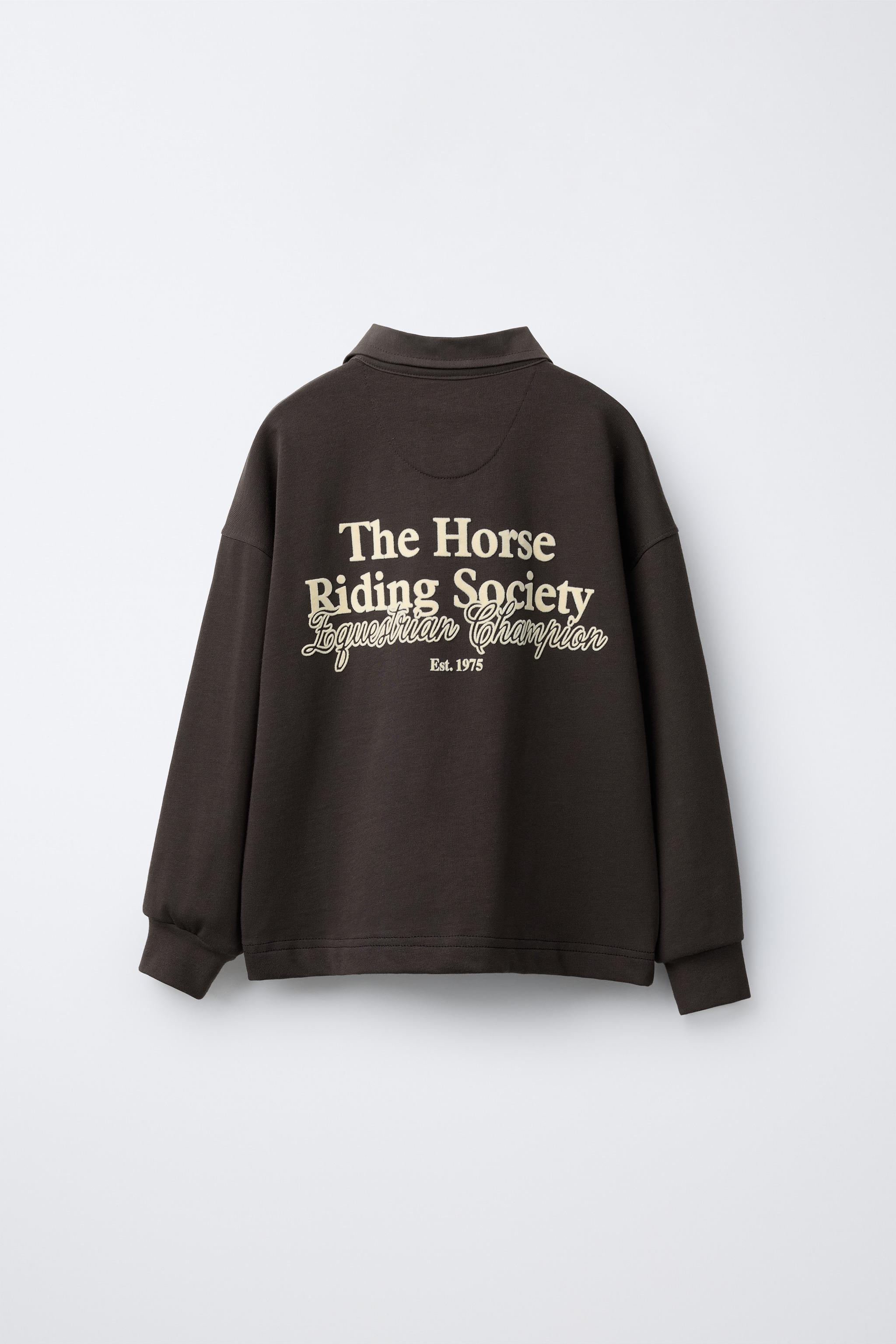 POLO AVEC INSCRIPTION EN VELOURS